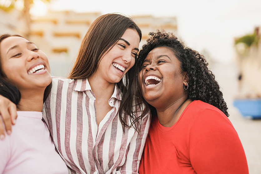 three teens laughing after orthodontic appointment with dr abosi at the smile design