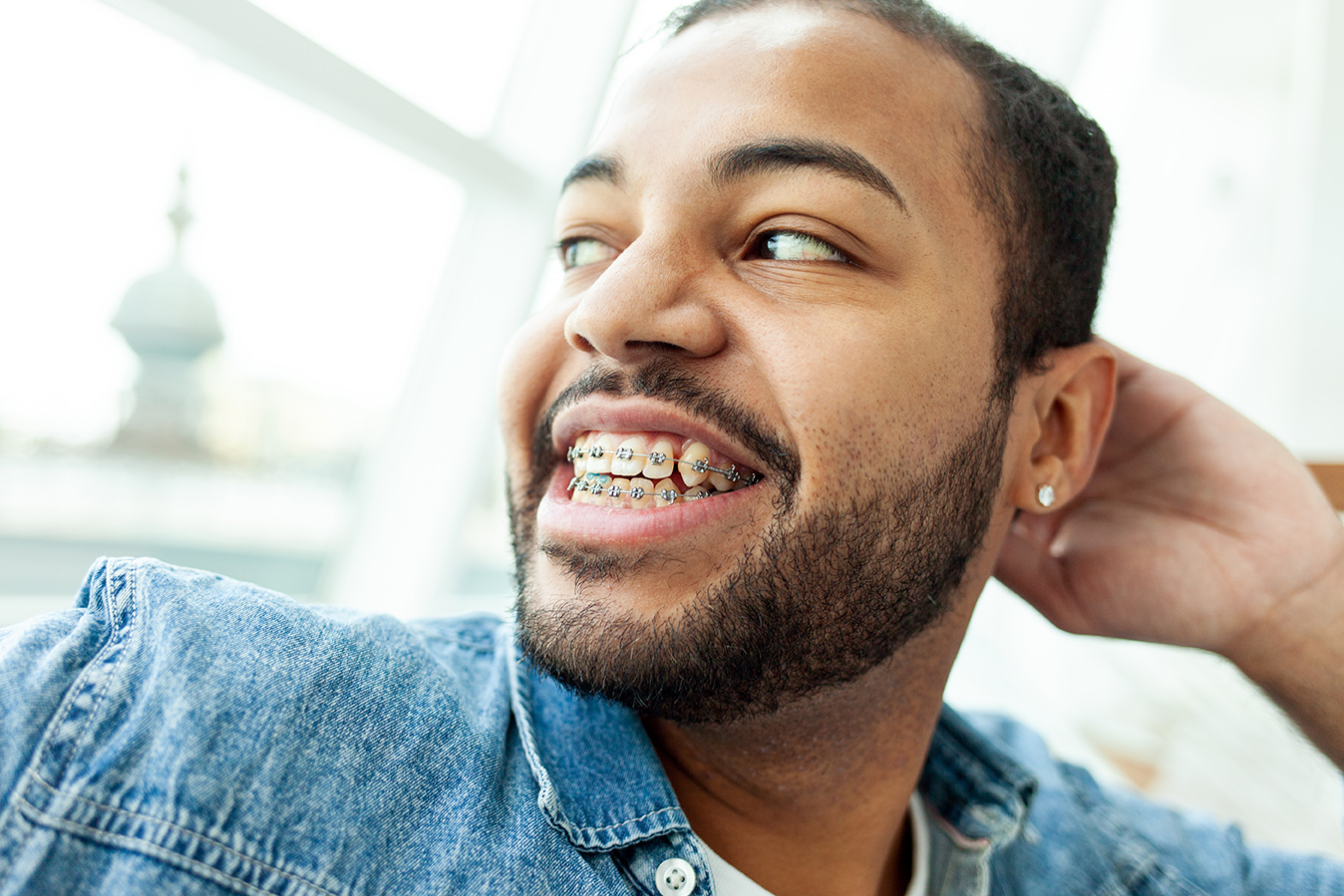 man with braces from the smile design in alpharetta georgia