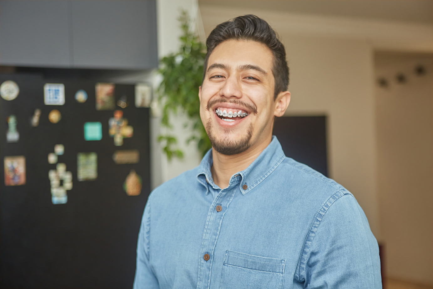 male with clear braces smiling in alpharetta ga